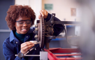 A student working on machinery