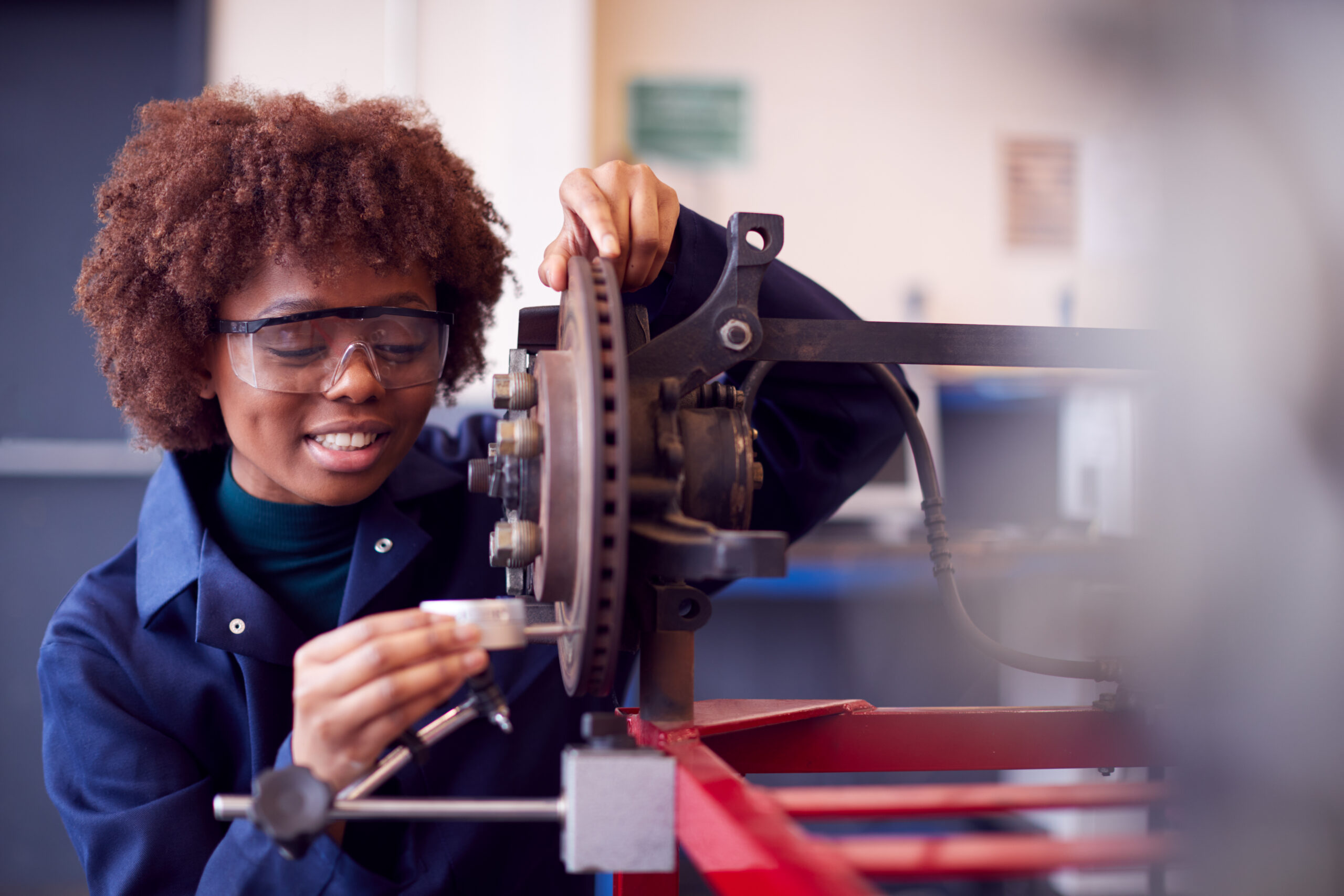 A student working on machinery